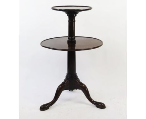A 19th century mahogany two tier circular dumb waiter, of graduated form on a ring turned column, on a swept tripod base term