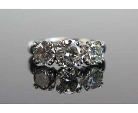 A TIFFANY &amp; CO. Platinum and Diamond Three Stone Ring, 6.9mm principal stone with 5.9mm shoulders, fully marked and with 