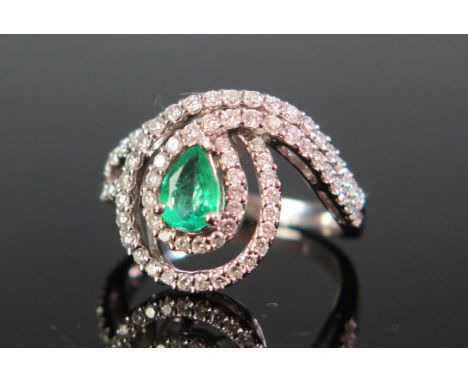 An 18ct White Gold, Emerald and Diamond Ring, c. 6.6x4.7mm principal stone, stamped 750, 5.22g 