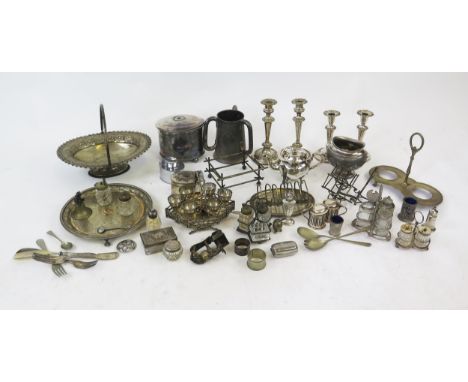 A quantity of assorted plated wares including tea caddy. swing-handled fruit basket, candlesticks, tea wares, condiments etc.