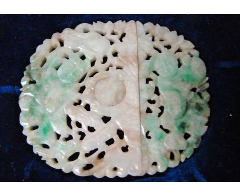 A late 19th/early 20th century Chinese jade belt buckle, of oval two piece form, carved and pierced decoration depicting two 