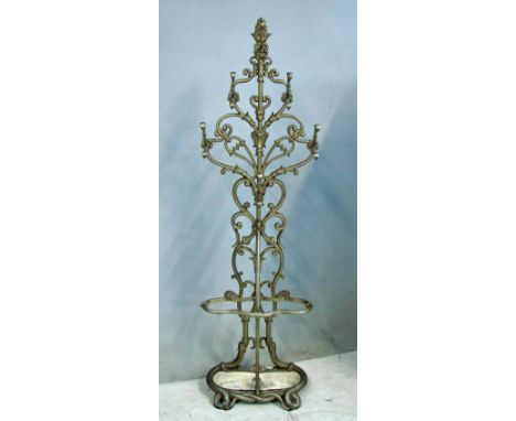A late 19th century cast iron hall stand of typical openwork form, naturalistic foliate style, fitted with coat hooks, stick 