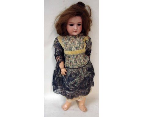 A German bisque head doll by Armand Marseille, sleeping brown eyes, open mouth, composite body, head stamped Made in Germany 