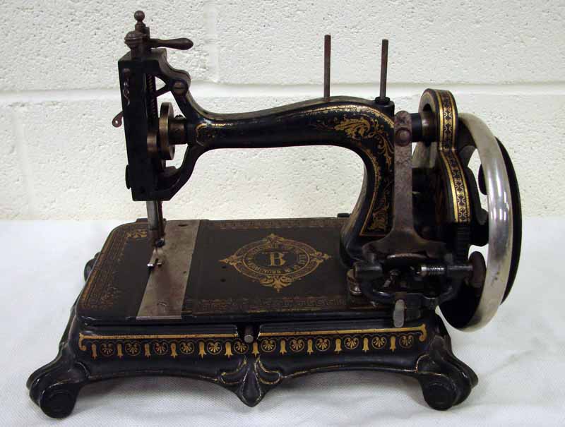 A 19th century Brunswick Atlas Model B sewing machine, set on a rounded