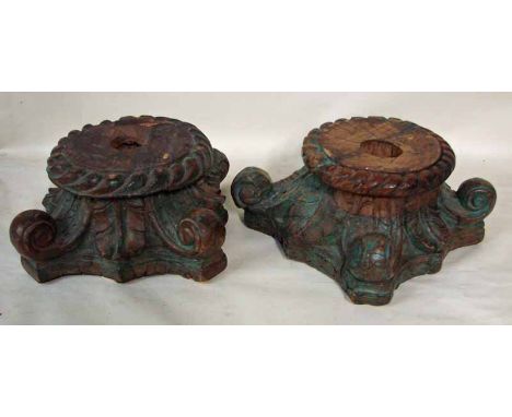 A pair of Chinese carved hardwood pedestals, circular rope edge top, four scroll feet on quadripartite base, possibly the bas