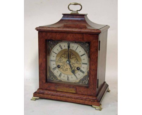 An early to mid 20th century walnut cased bracket clock, pagoda top case with brass carry handle, glazed door to front enclos