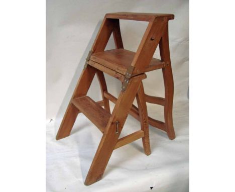 A 19th century pine metamorphic library step chair, ladder back, hinged solid seat, three pine steps, 69cm high as steps 