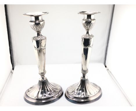 A pair of silver plate regency style candlestick holders. 25cm tall. Postage B