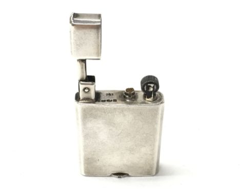 A vintage silver pocket lighter. Postage A