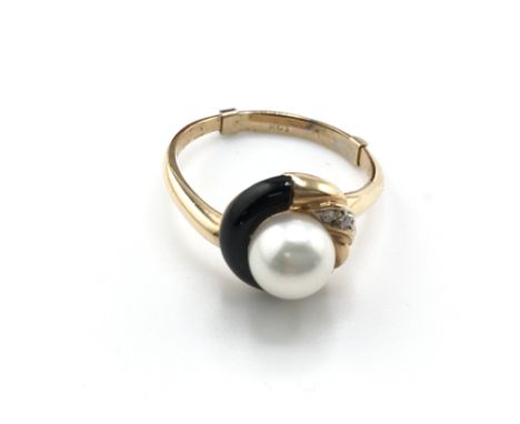 A modern design 18carat gold ring with matching earrings set with pearl and small diamonds.weight 7.5g