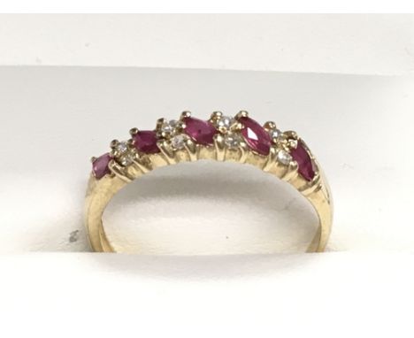 9ct yellow gold 9 stone marquise ruby and R/C diamond ring. Boxed, ring size Approx O/P. Postage category A.