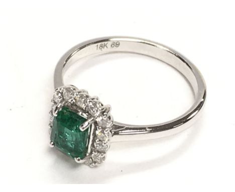 Certificated 18ct white gold octagonal mixed cut emerald and RBC diamond cluster ring. Emerald 0.85ct. Diamonds 0.28ct. Cert 