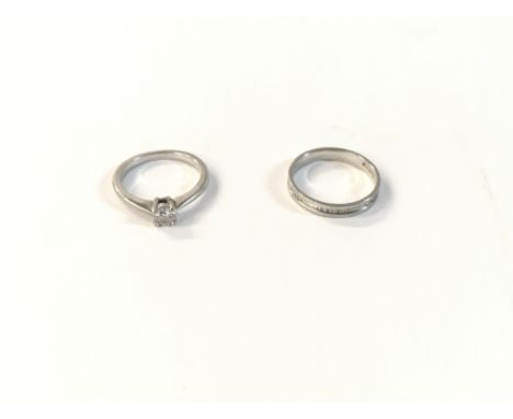 A beaver brooks platinum diamond set band and a diamond solitaire wedding ring. With a certificate for the diamond set band. 