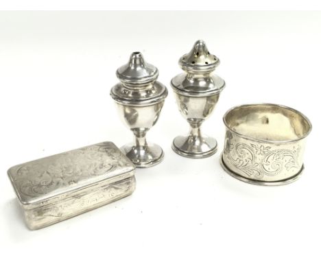 A Collection on silver items including a snuff box, napkin ring and shakers. Postage category A