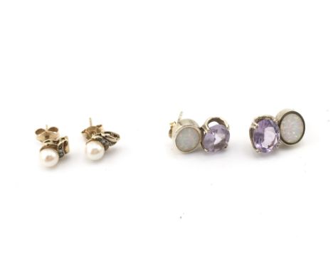 A pair of gold pearl set earrings and a pair of silver earrings set with opal and purple stone. Postage A