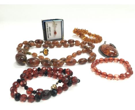 A Collection of amber including necklaces, bracelets, a ring. Postage catA