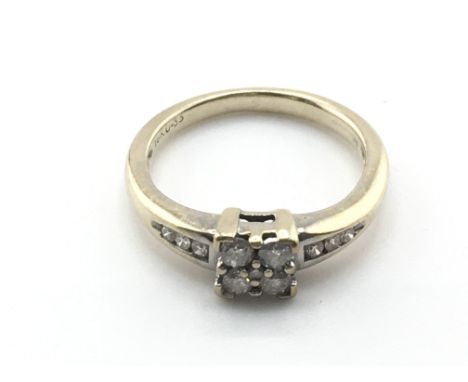 An 18ct gold ring set with diamonds. Approximately 0.33ct total. Size M 1/2 and 4.1g