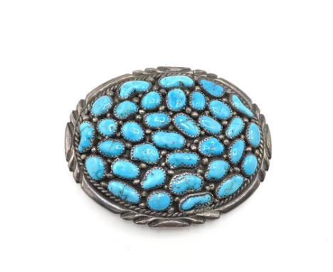 A vintage mens sterling silver and turquoise belt buckle. Approximately 8cm wide and 55.34g. Postage B