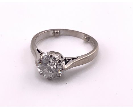 An 18ct white gold solitare ring set with a single 1ct diamond. (A)
