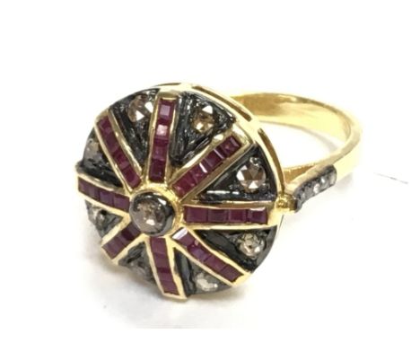 Silver gilt target style ring set with yellow and white rose cut diamonds and step cut rubies. Diamonds 0.70ct. Rubies 1.10ct