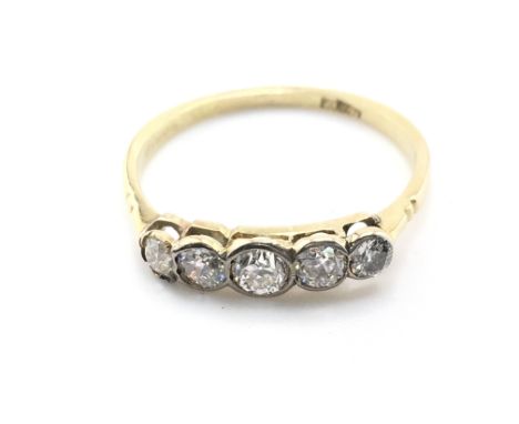 A 5 stone graduated 18ct gold ring. Size S 1/2 and 2.15gPostage A