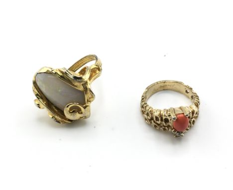 Two yellow metal one set with large opal. One size M 1/2 and other J Postage B
