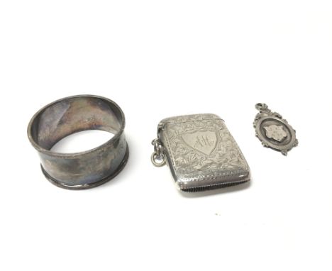 Silver hallmarked items including a Napkin ring, a medal and a silver plated vesta. Postage category a. NO RESERVE