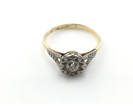 An 18ct gold and platinum ring sent with small diamond. Size M and 1.93g Postage A