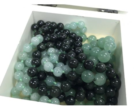 Three Jade necklaces. Postage category A