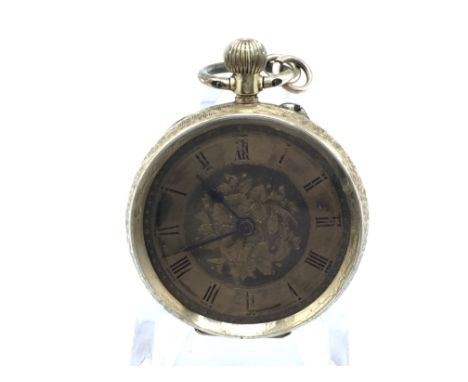 A 14ct gold button wind pocket watch. Winds and runs. Postage B