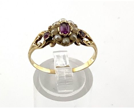 An antique unmarked high carat ruby and seed pearl ring (A)