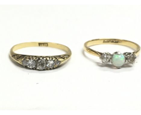 An 18ct gold ring with chip stone diamonds and an 18ct gold and platinum Opal and diamond set ring. Ring sizes L/M & M/N. Pos
