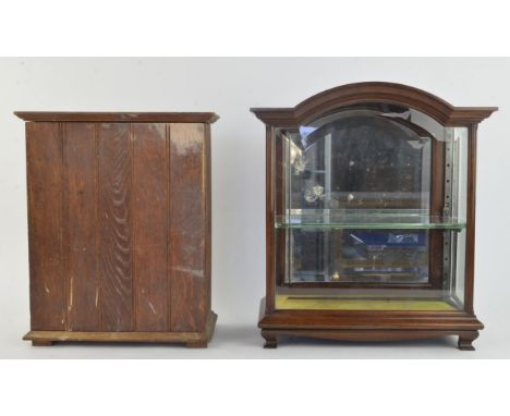 An Edwardian mahogany table cabinet, the front and sides with bevelled glass, the rear door mirrored, shelf supports later, H