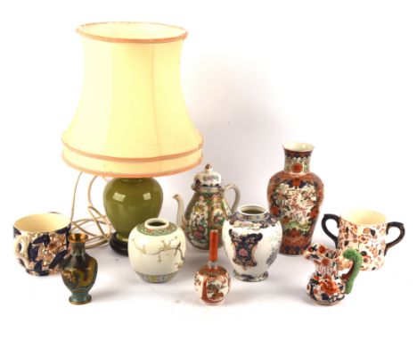 A quantity of Asian and European Ceramics, including: a Canton famille rose teapot; a Japanese Imari vase, decorated with pan