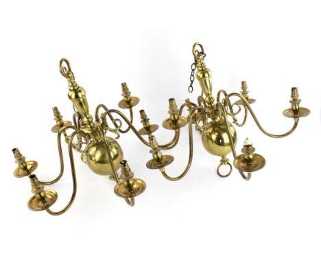 A pair of 18th century style, Dutch, six branch brass chandeliers.  38cm high. and one larger, similar brass chandelier.  (3)