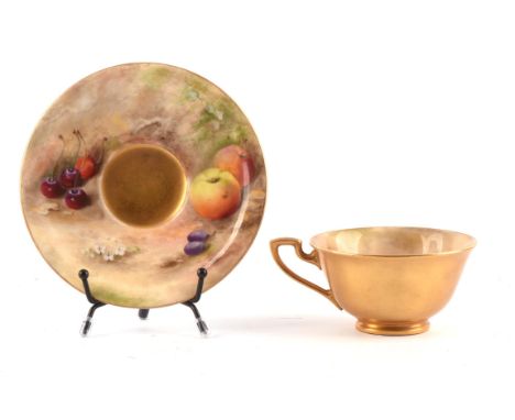 A Royal Worcester cup and saucer, decorated by Ricketts, decorated with fruit and cherries, signed, puce mark, Rd No 651926, 