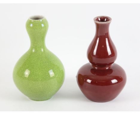 Two  monochrome Chinese vases, including: one of lime green hue with a crackle design, about 17cm high; together with a spina