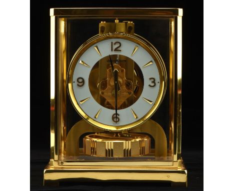 A late 20thC Jaeger-le-Coultre Atmos table clock, the brass dial with white chapter ring bearing Arabic numerals at quarters,