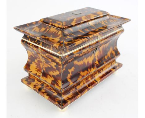 A Victorian tortoiseshell tea caddy, of waisted pagoda form and strung throughout with white metal, the concave lid enclosing