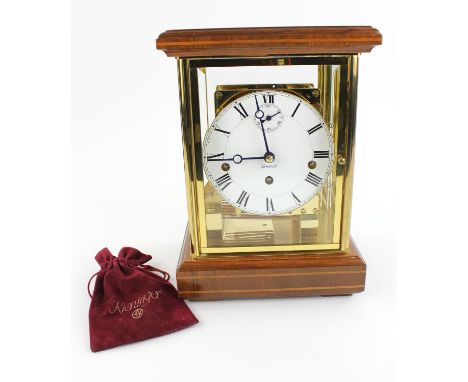 A 20th century German lacquered brass and mahogany four glass mantel clock by Kieninger, the eight day movement chiming on go