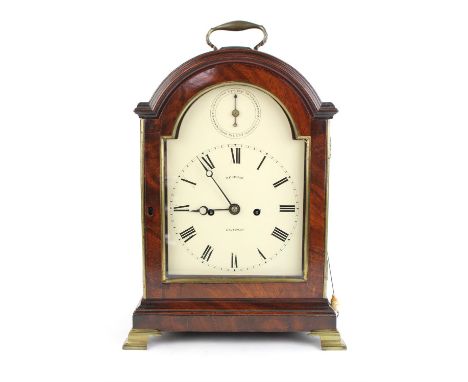 A Regency mahogany arch top bracket clock by Desbois London.  Brass single handle and white painted dial plate detailed 'DESB