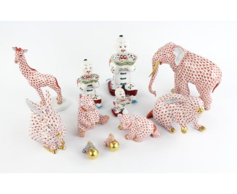 Eleven Herend porcelain ornaments comprising ; set of three graduated Oriental kneeling men, each holding an ingot shaped bow