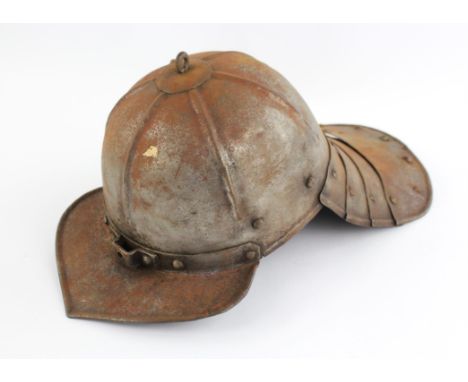 A reproduction Cromwellian style lobster tail steel helmet.