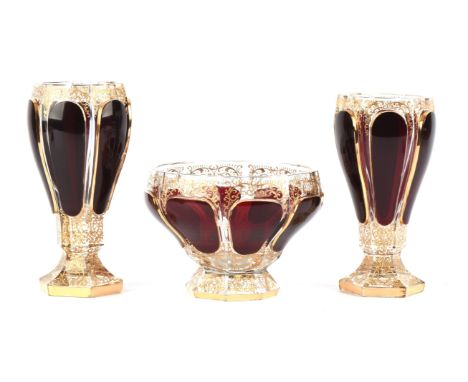 A pair of Victorian ruby red and gilt decorated glass vases, 19cm high with a matching bowl, 12cm high,