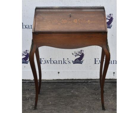A French rosewood and inlaid bureau de dame, Louis XVI style, late 19th Century, the top with pierced brass rail above a fall