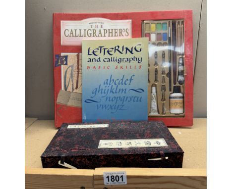 A Chinese boxed writing set, Boxed readers digest calligraphy set &amp; book