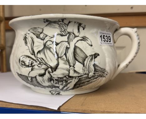 A vintage chamber pot/planter