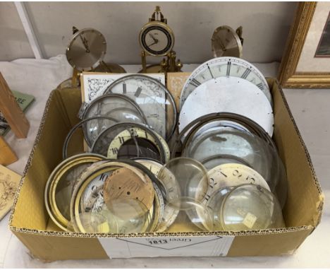 A quantity of clock parts. clock faces, glasses &amp; domeless mantle clocks etc.