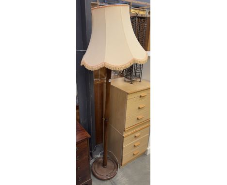 A mahogany standard lamp with shade.