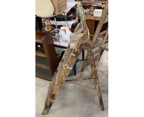 A vintage wooden step ladder